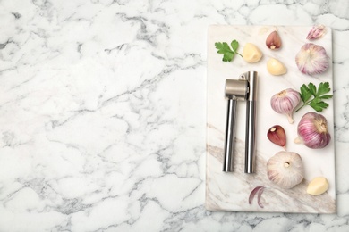 Photo of Flat lay composition with garlic press on table