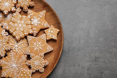 Tasty Christmas cookies on grey table, top view. Space for text