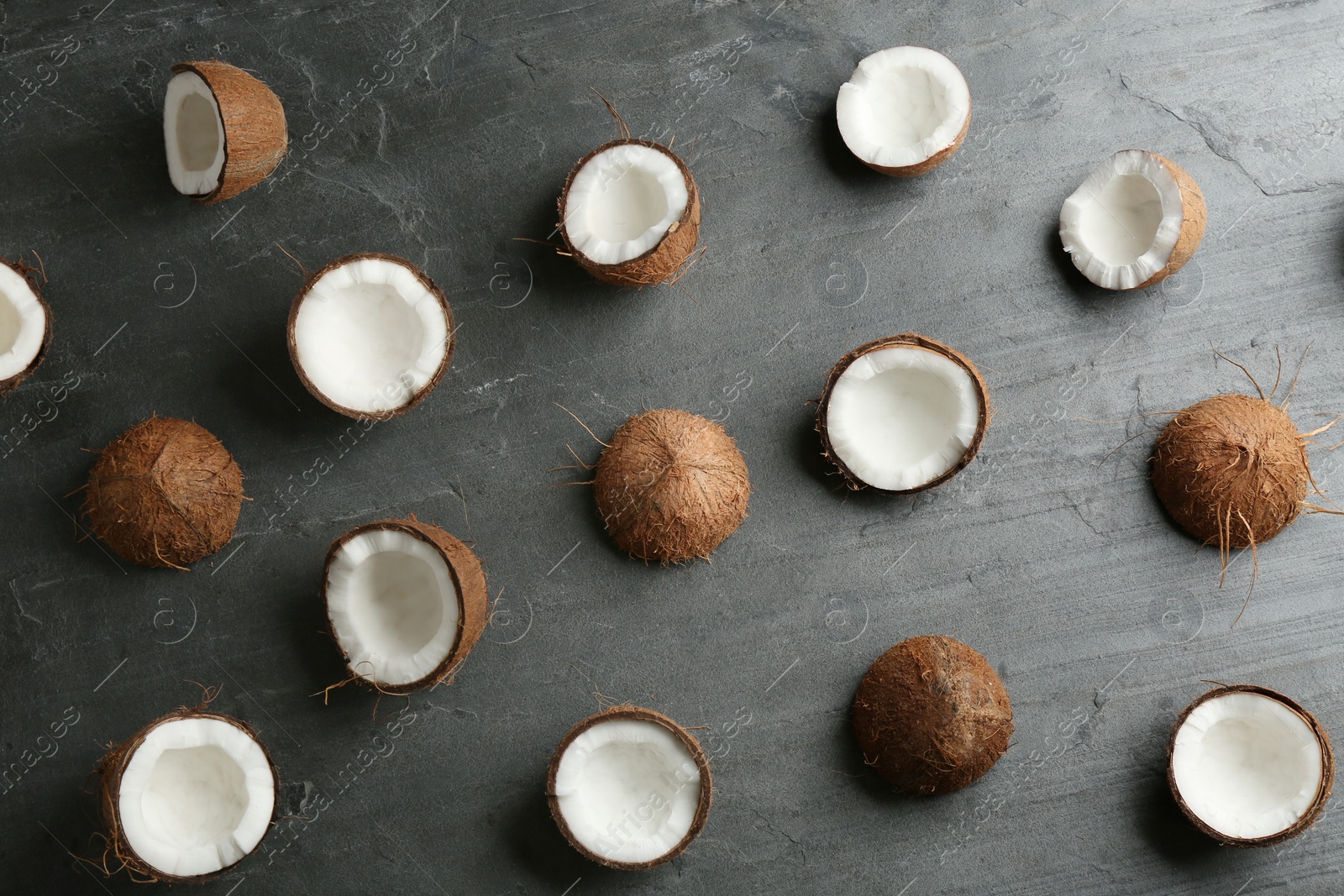 Photo of Coconut pattern on grey table, flat lay