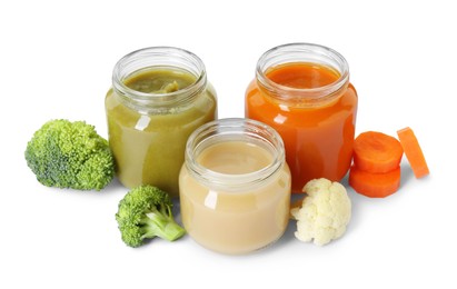 Jars with healthy baby food, carrot, broccoli and cauliflower isolated on white