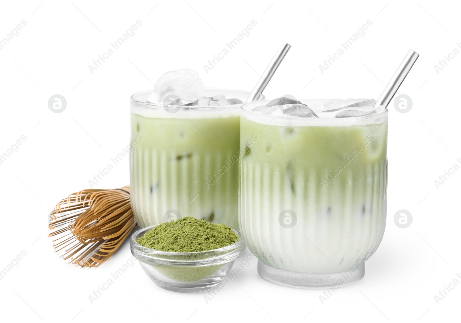 Photo of Glasses of tasty iced matcha latte, bamboo whisk and powder isolated on white