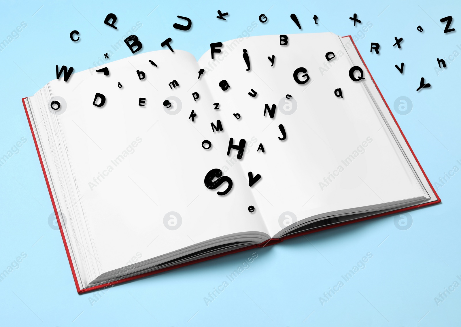 Image of Open book with many letters on light blue background, above view