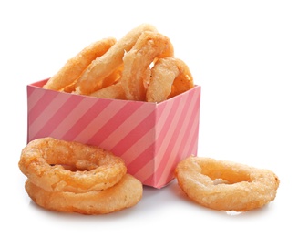 Photo of Box with fried onion rings on white background