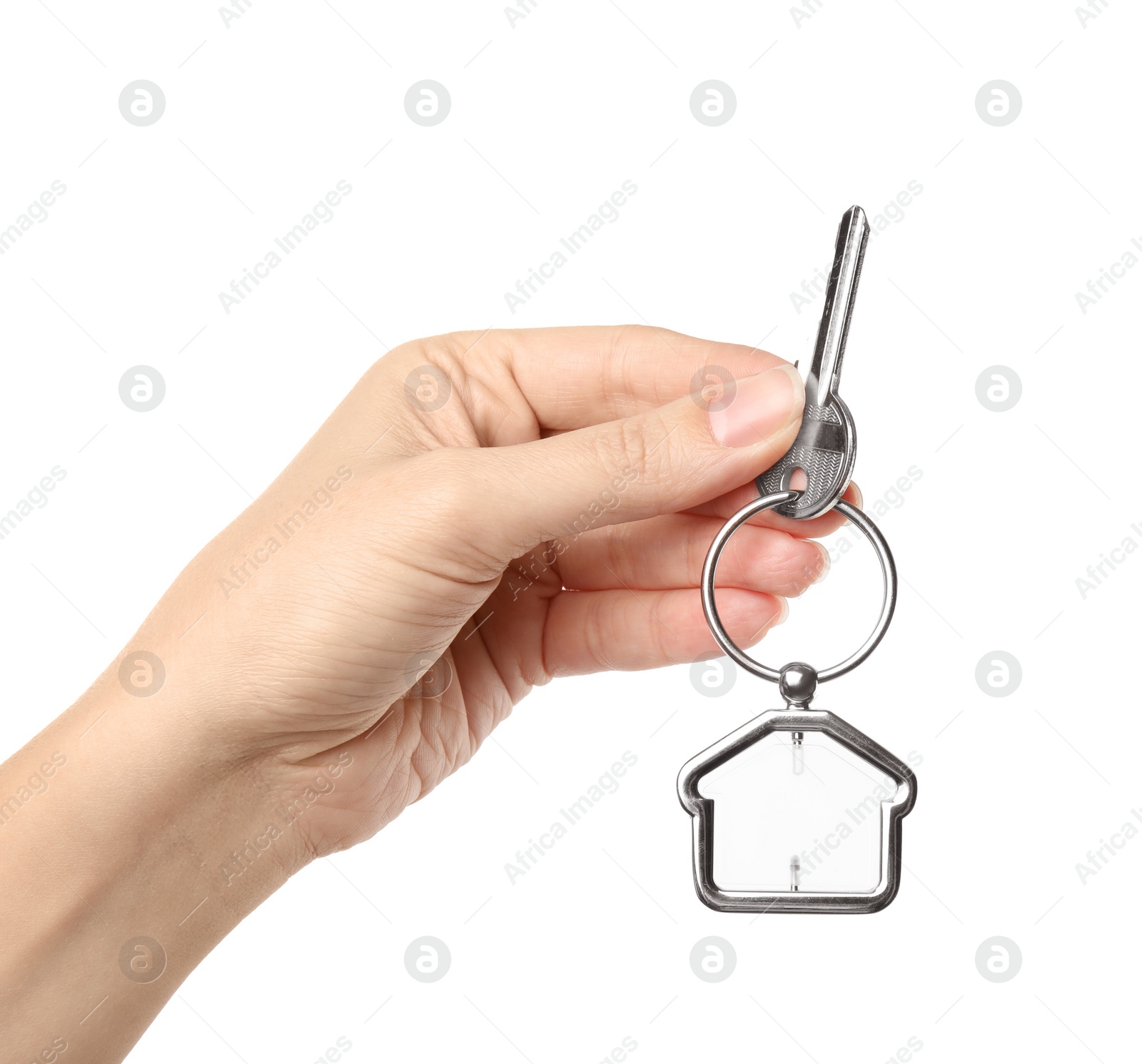 Photo of Woman holding house key with trinket on white background, closeup