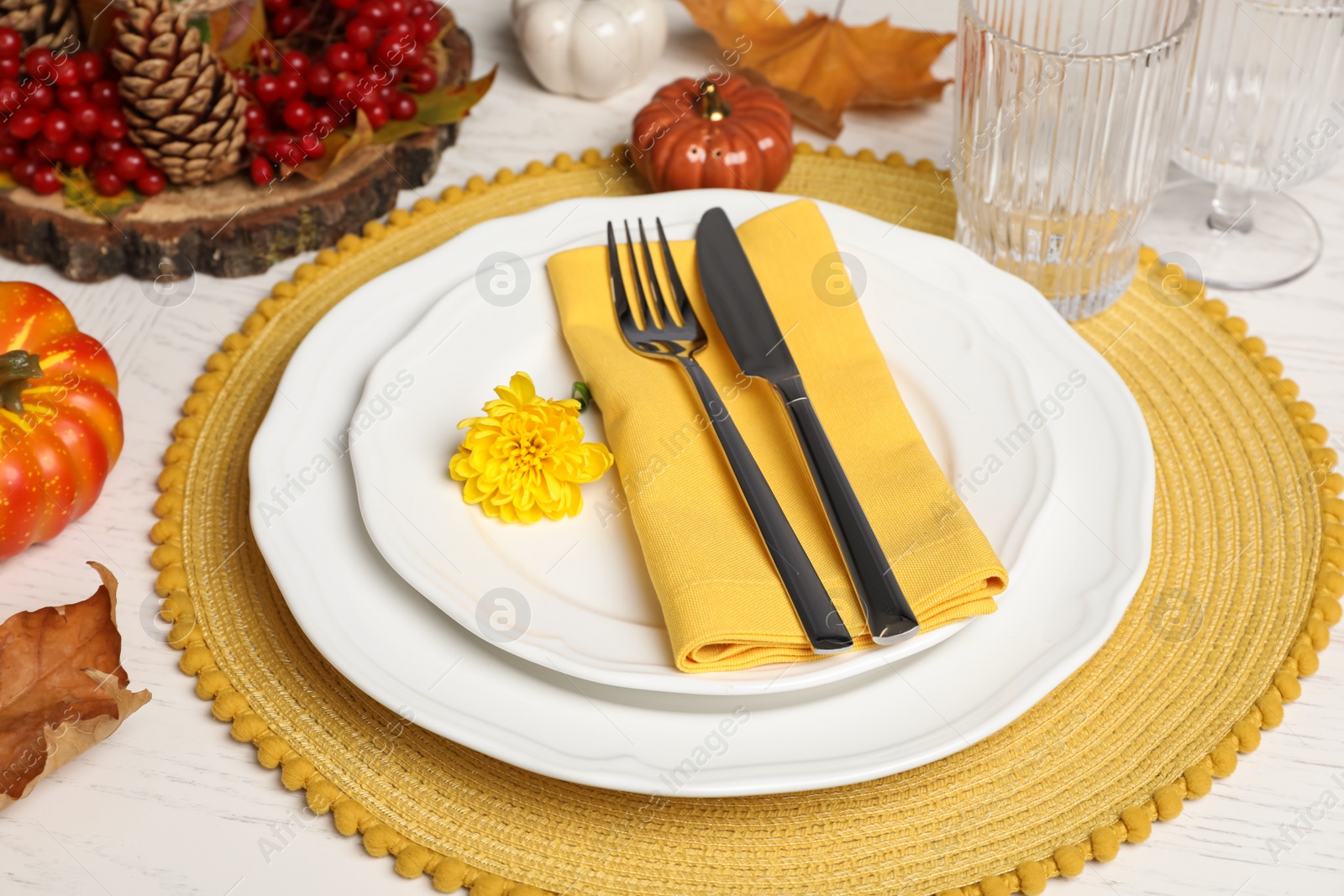 Photo of Autumn table setting with floral decor and pumpkins