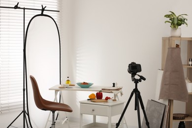 Professional equipment and composition with delicious spaghetti on white wooden table in studio. Food photography