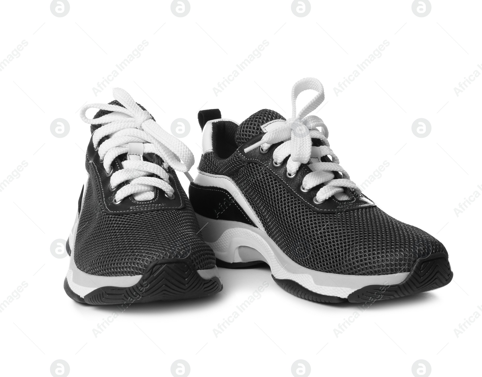 Photo of Pair of stylish modern training shoes on white background