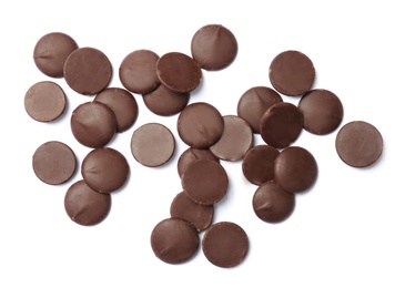 Photo of Delicious black chocolate chips on white background, top view