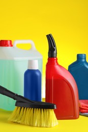 Photo of Different car cleaning products on yellow background