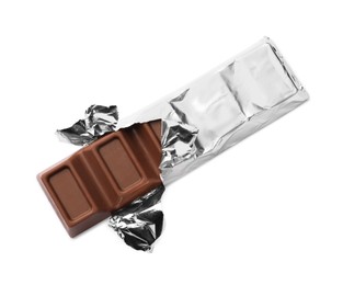 Delicious wrapped chocolate bar on white background, top view