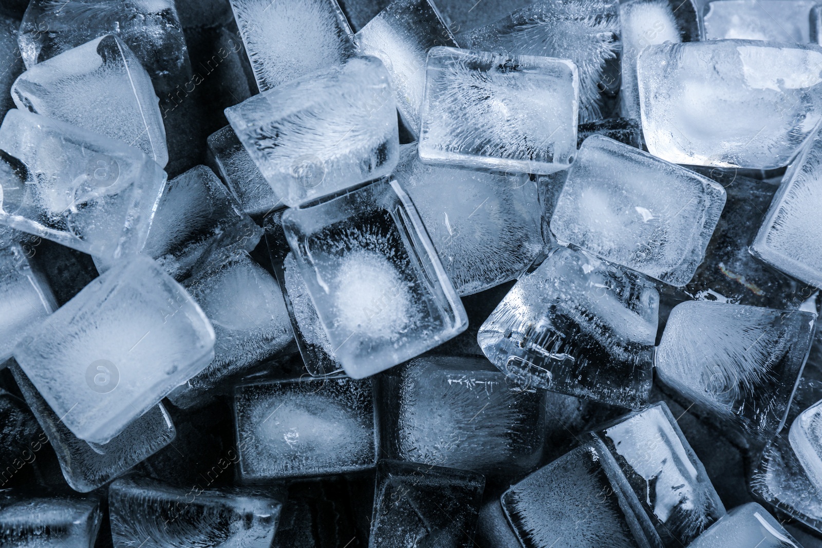 Photo of Pile of ice cubes as background, top view