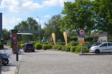 Photo of Winschoten, Netherlands - June 02, 2022: Beautiful view of city street with cars on sunny day