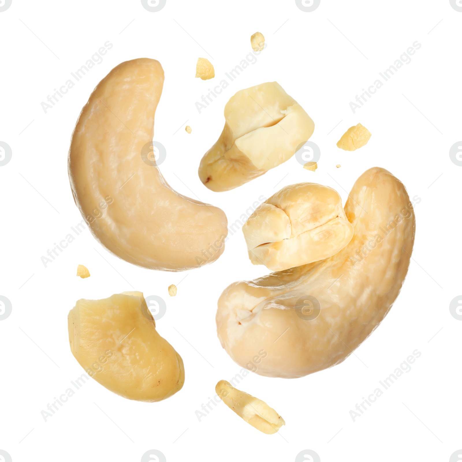 Image of Tasty cashew nuts flying on white background