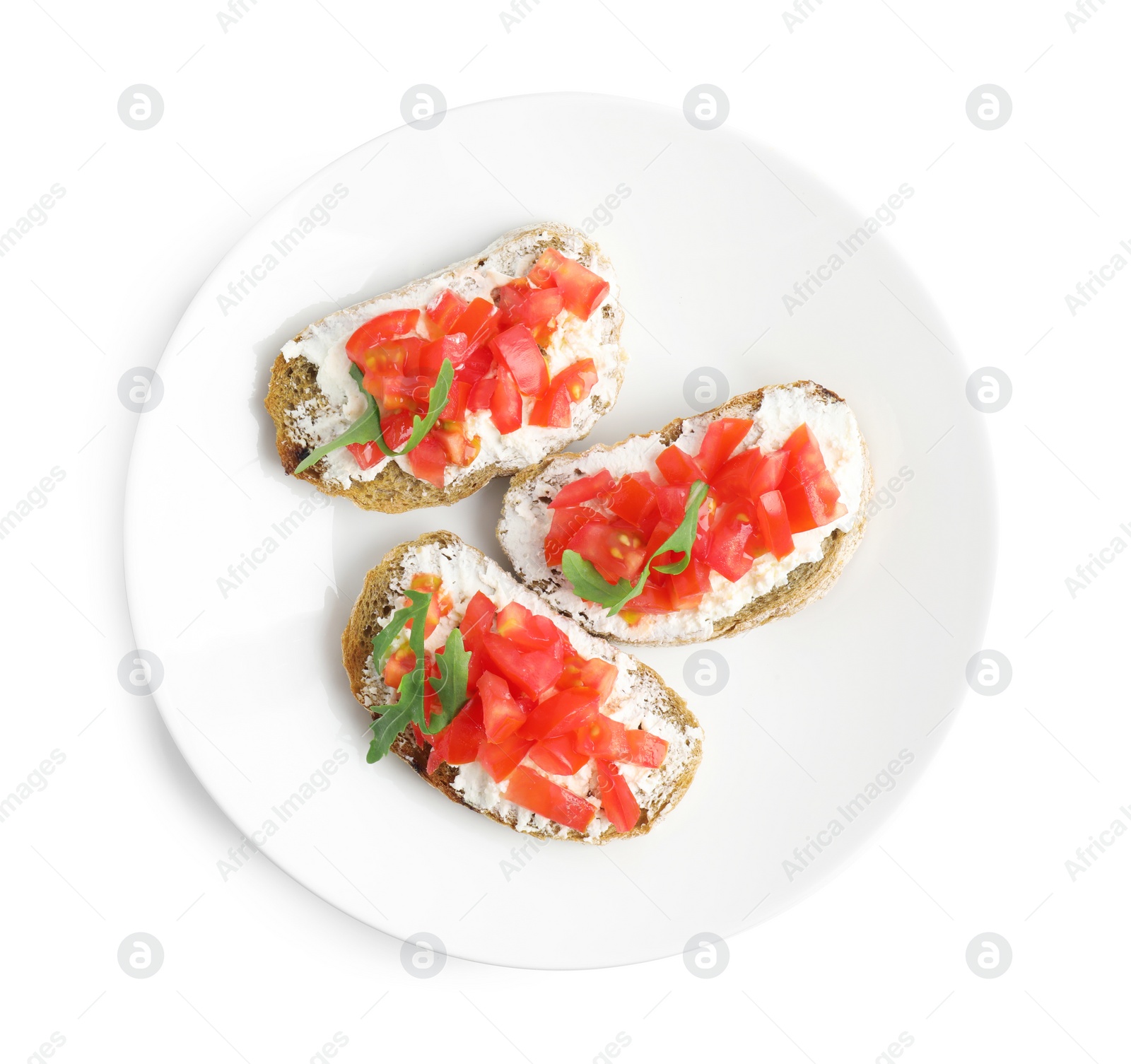 Photo of Plate of delicious tomato bruschettas on white background, top view