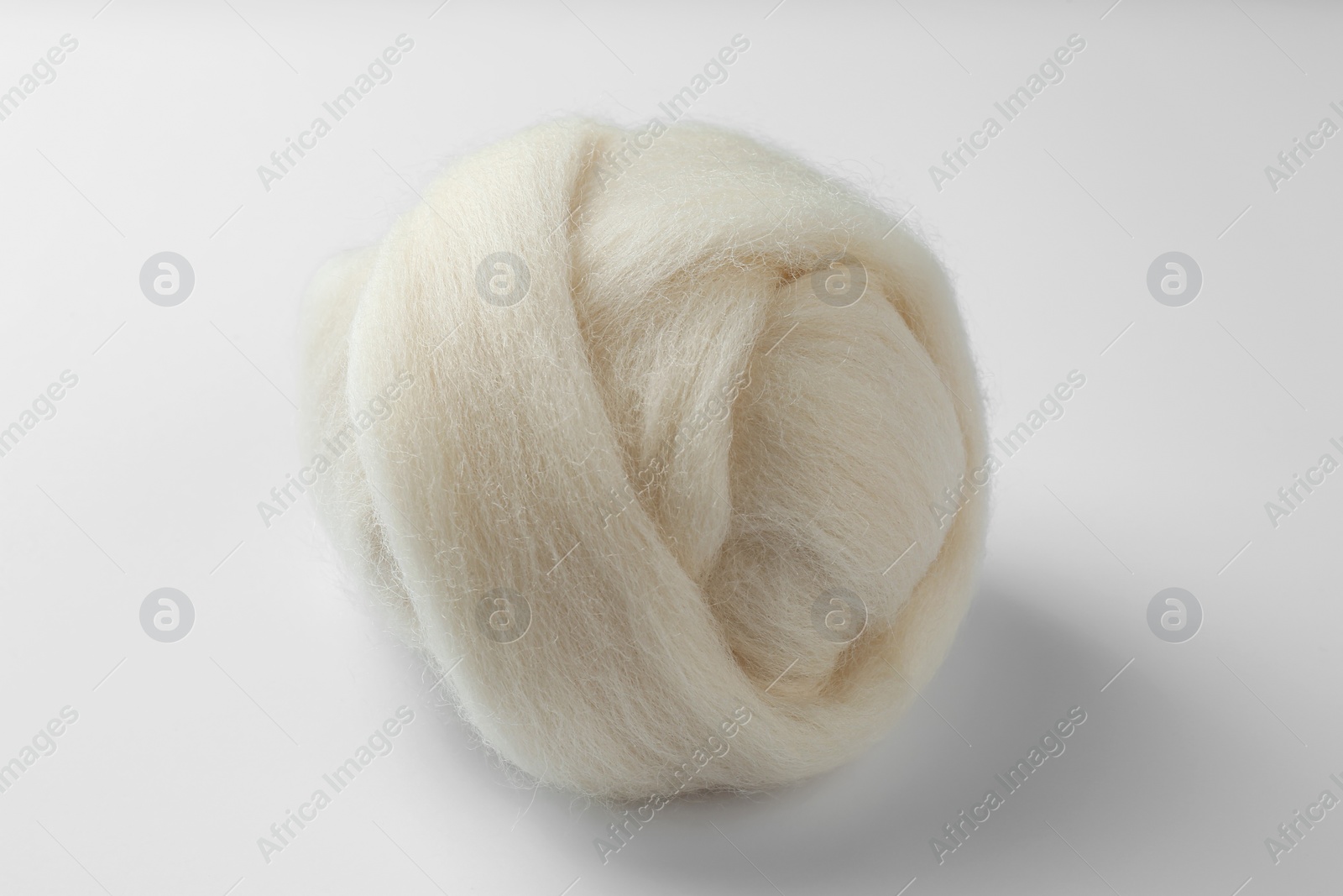 Photo of Ball of combed wool isolated on white