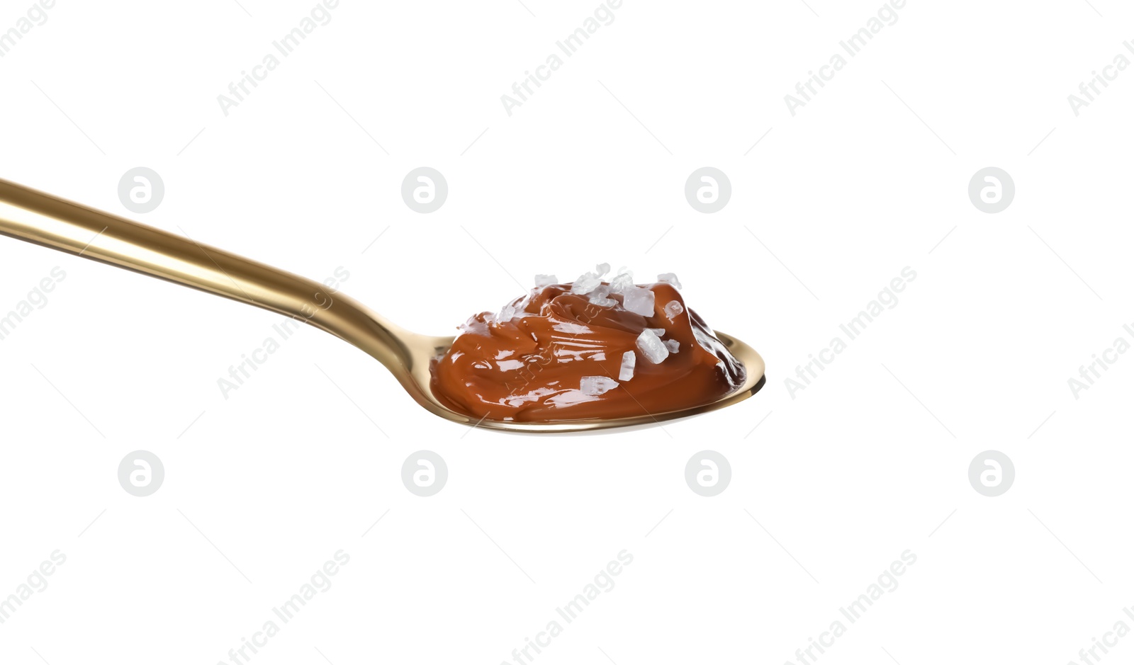 Photo of Salted caramel in spoon isolated on white