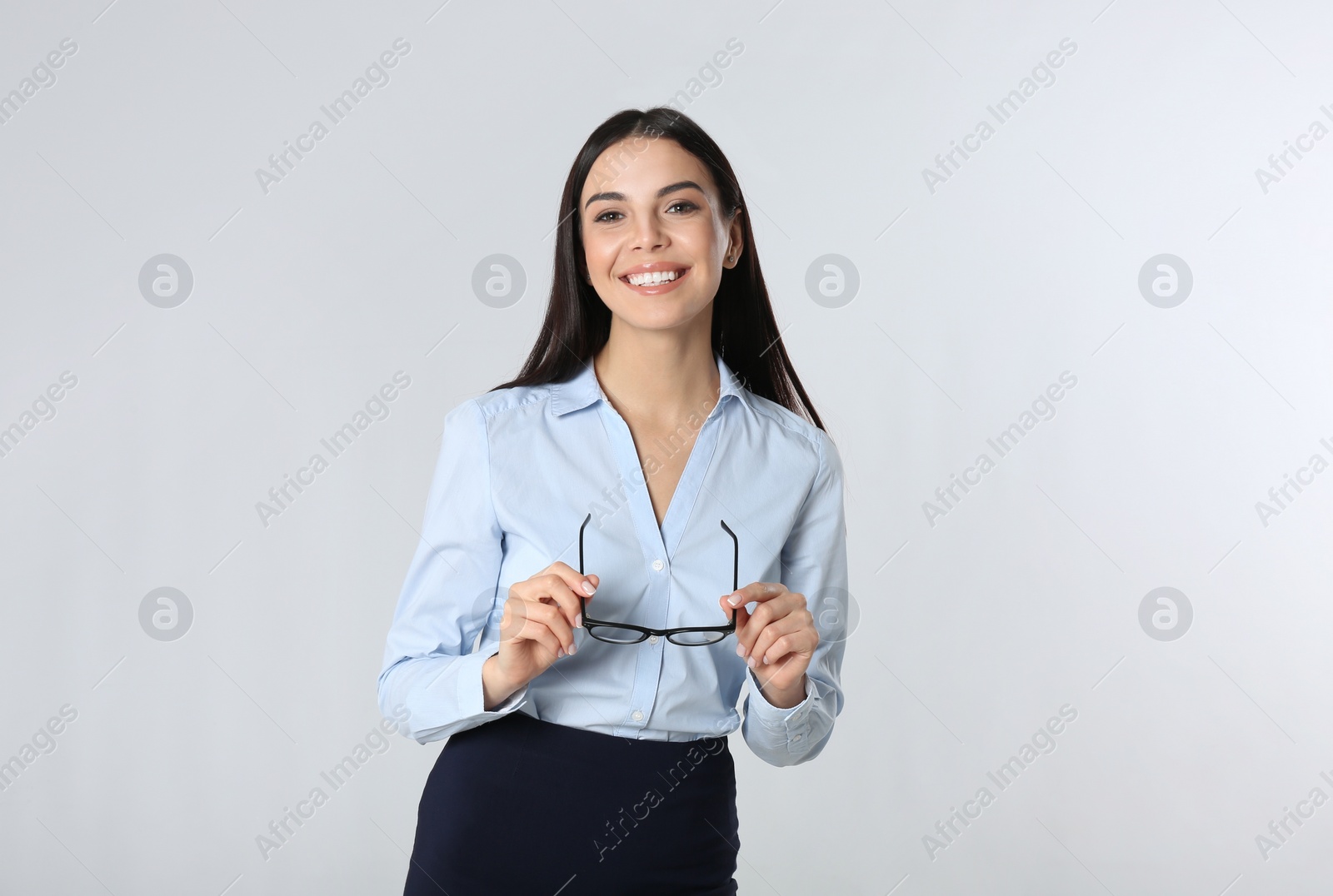 Photo of Portrait of young businesswoman on white background