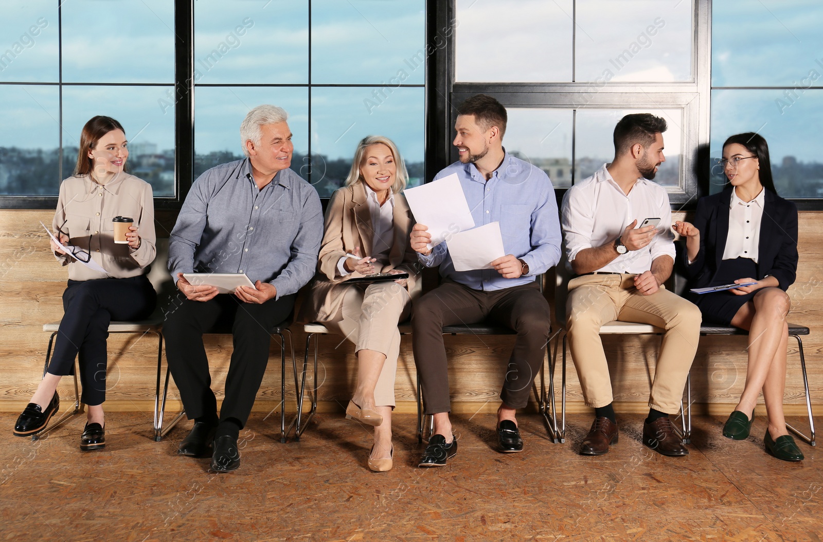 Photo of People waiting for job interview in office hall