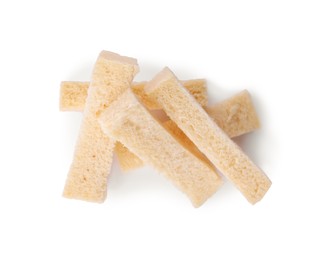 Photo of Crispy rusks on white background, top view