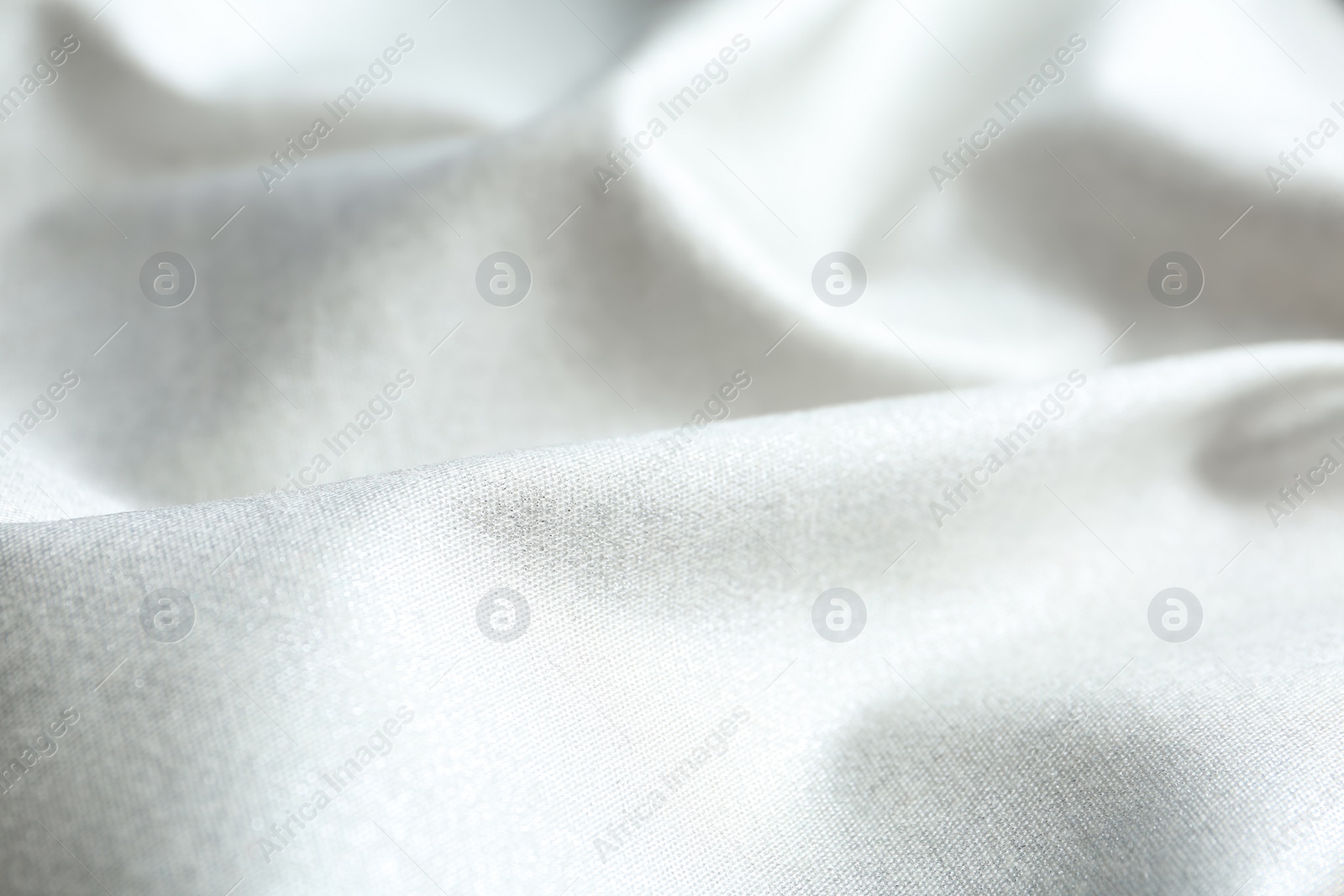 Photo of Texture of delicate white fabric as background, closeup