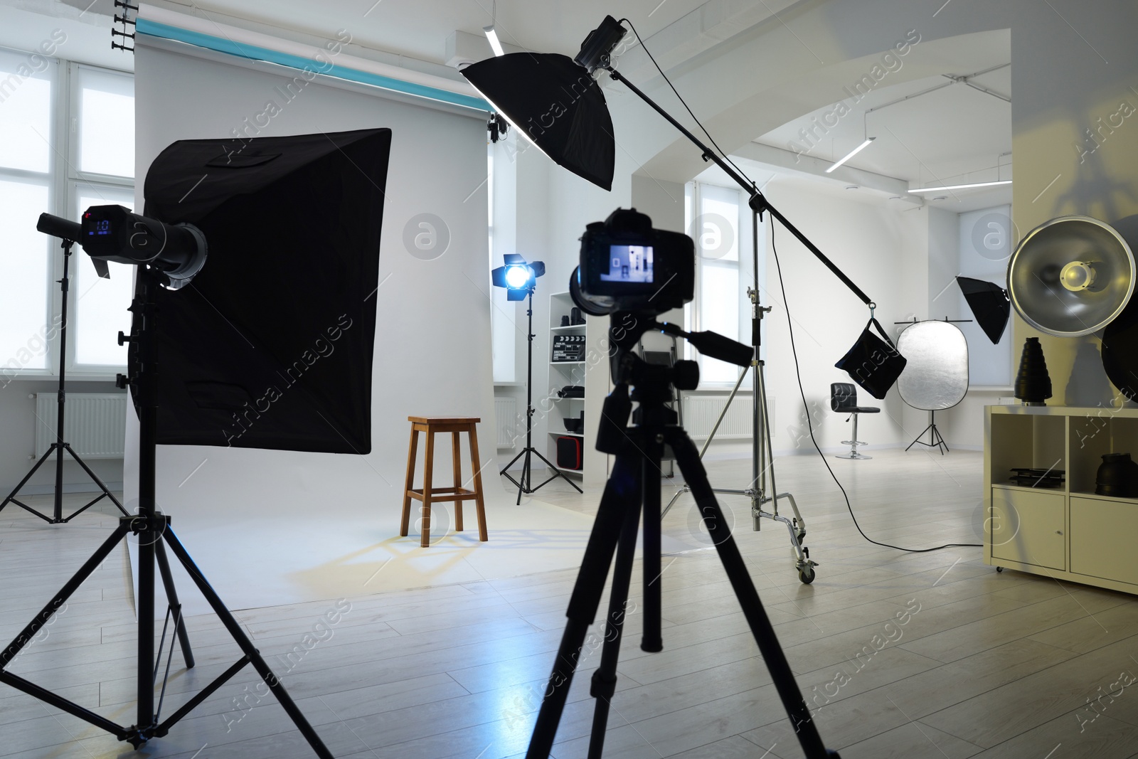 Photo of Stool, camera and different equipment for casting in studio