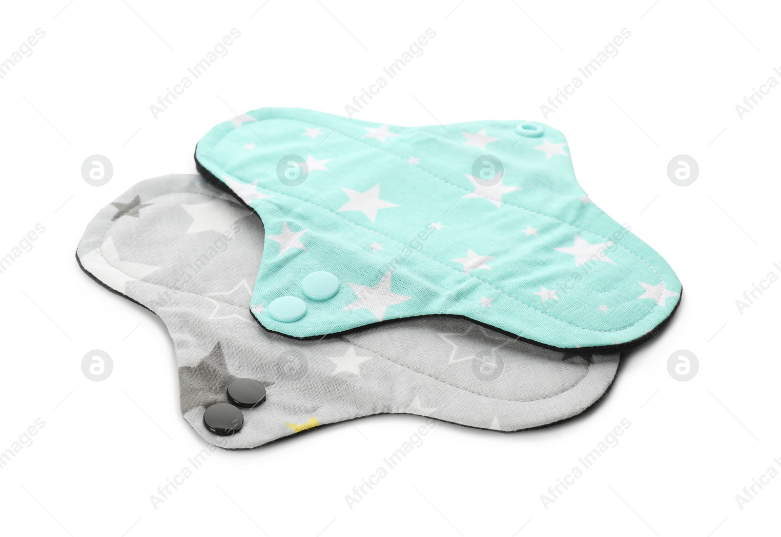 Photo of Cloth menstrual pads on white background. Reusable female hygiene product