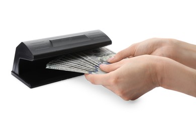 Photo of Woman checking dollar banknotes with currency detector on white background, closeup. Money examination device