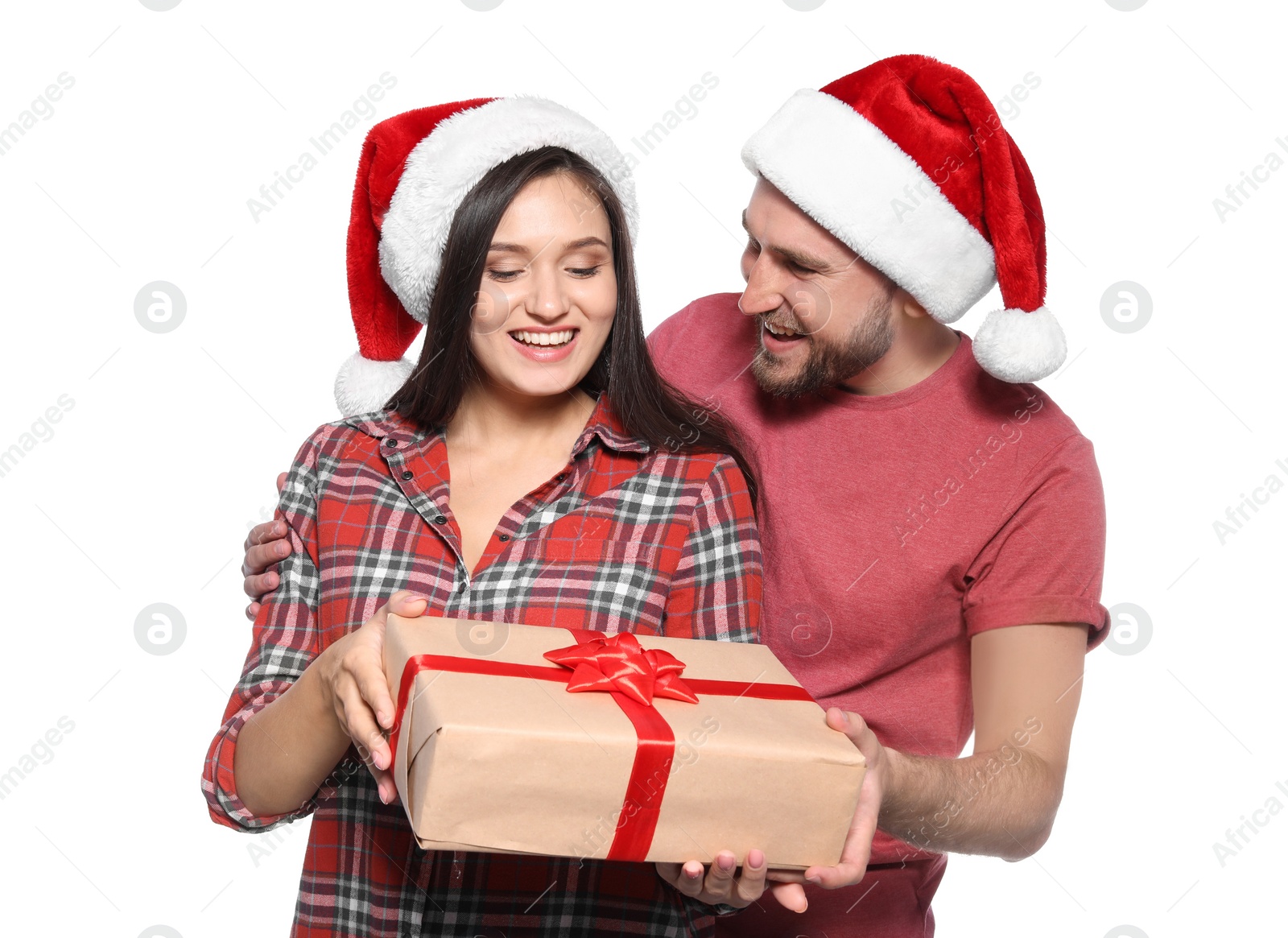 Photo of Young couple with Christmas gift on white background