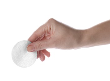 Photo of Woman holding soft clean cotton pad on white background, closeup