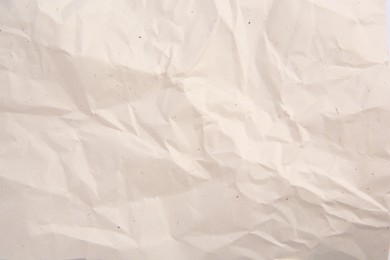 Photo of Texture of crumpled parchment paper as background, top view