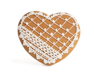 Photo of Gingerbread heart decorated with icing isolated on white