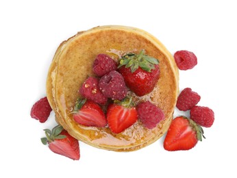 Tasty pancakes with fresh berries and honey on white background, top view