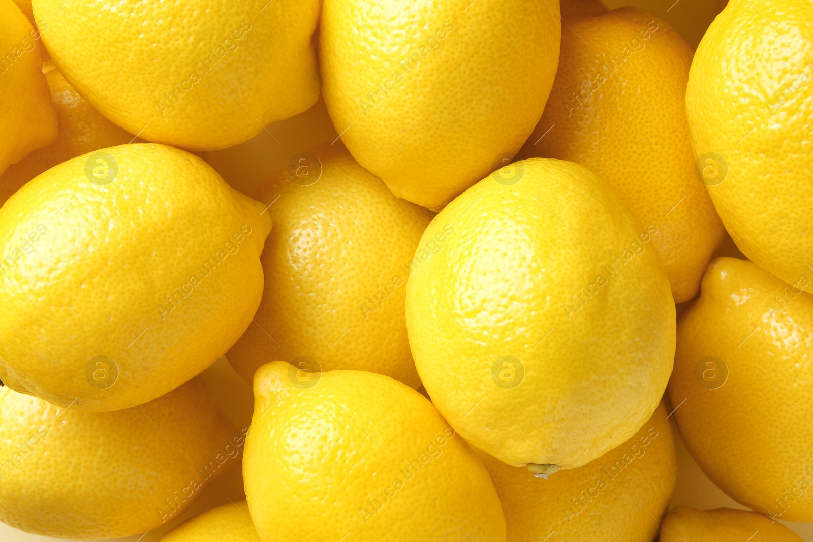 Photo of Many fresh ripe lemons as background