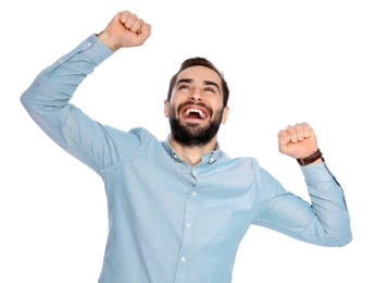 Photo of Young man celebrating victory on white background