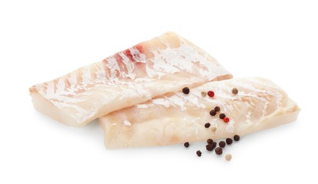 Photo of Fresh raw cod fillets with peppercorns isolated on white