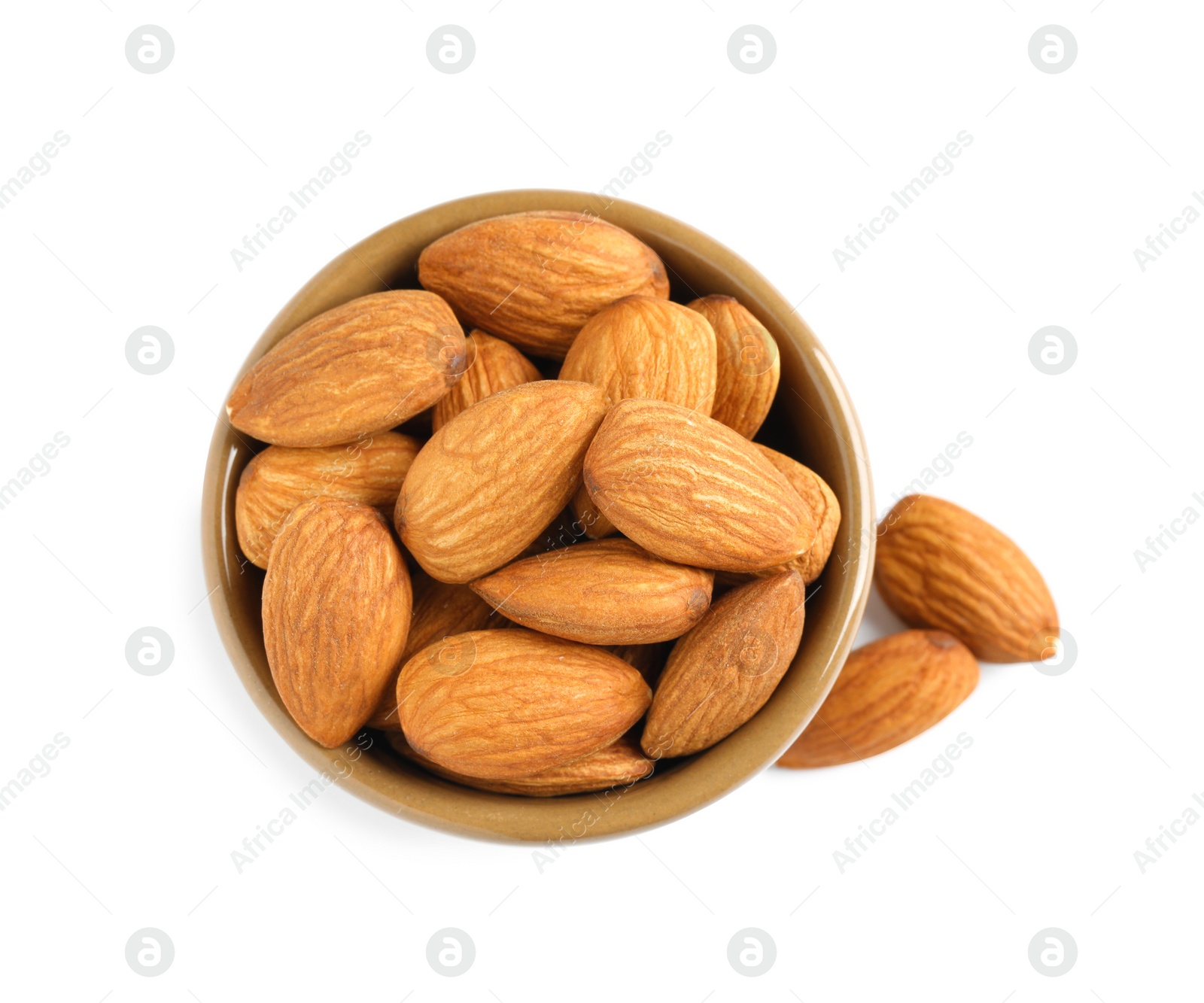 Photo of Bowl and organic almond nuts on white background, top view. Healthy snack