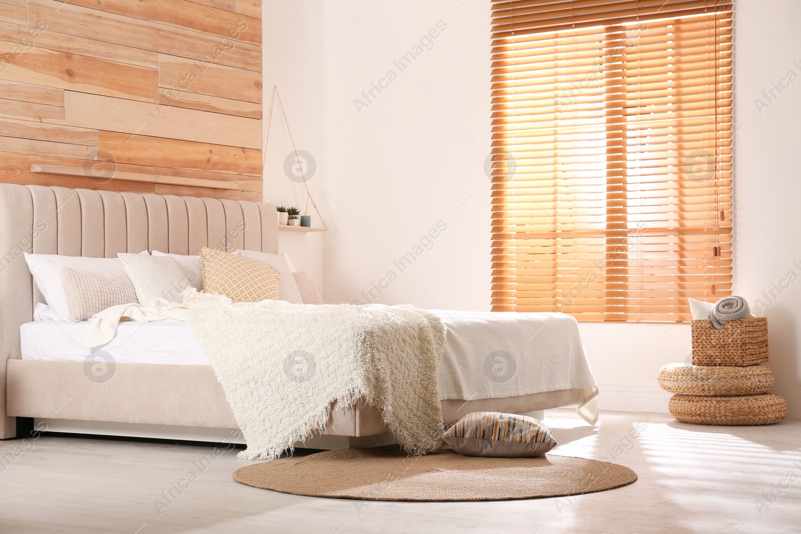 Photo of Stylish room interior with big comfortable bed