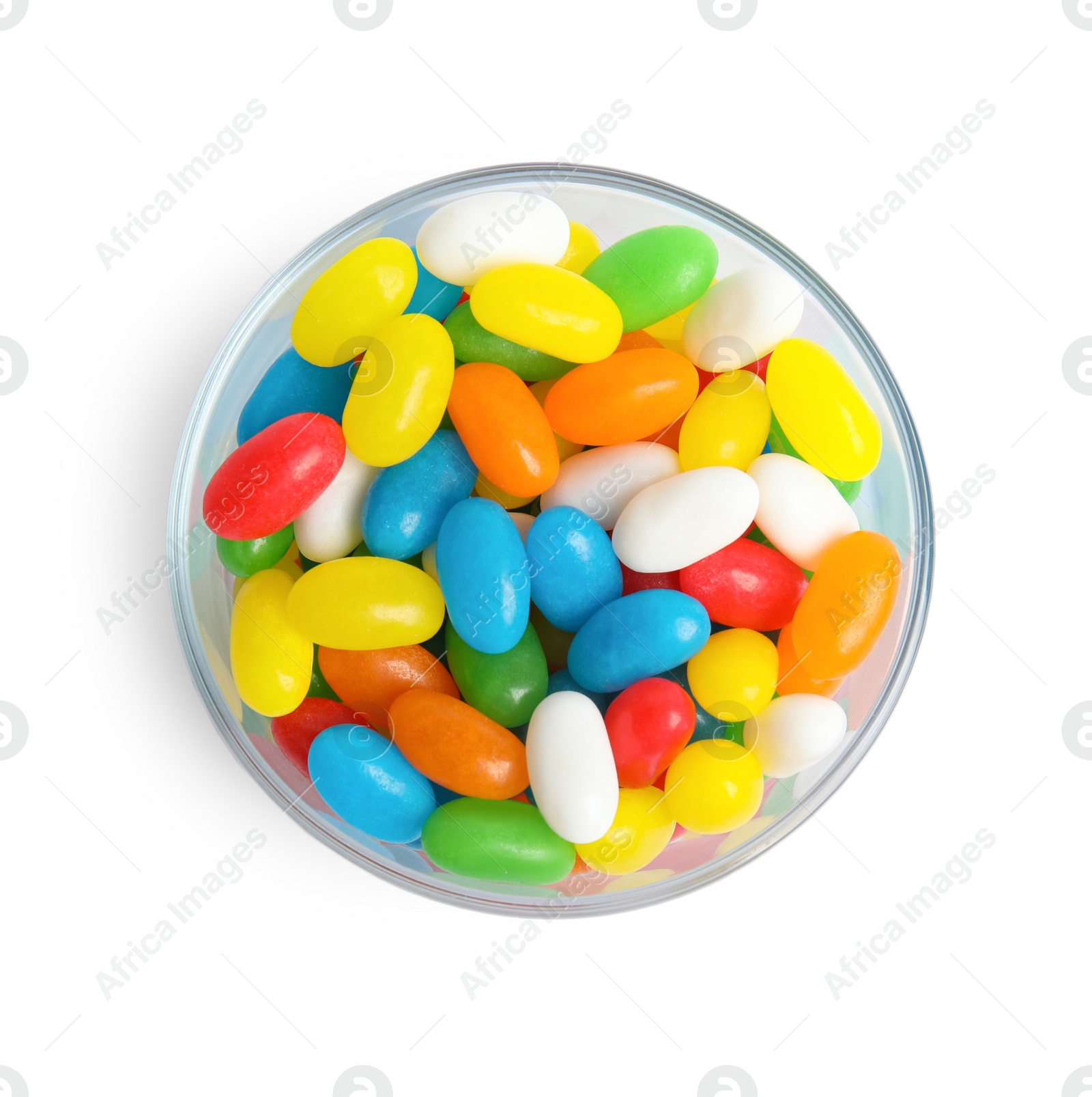 Photo of Glass of delicious color jelly beans isolated on white, top view