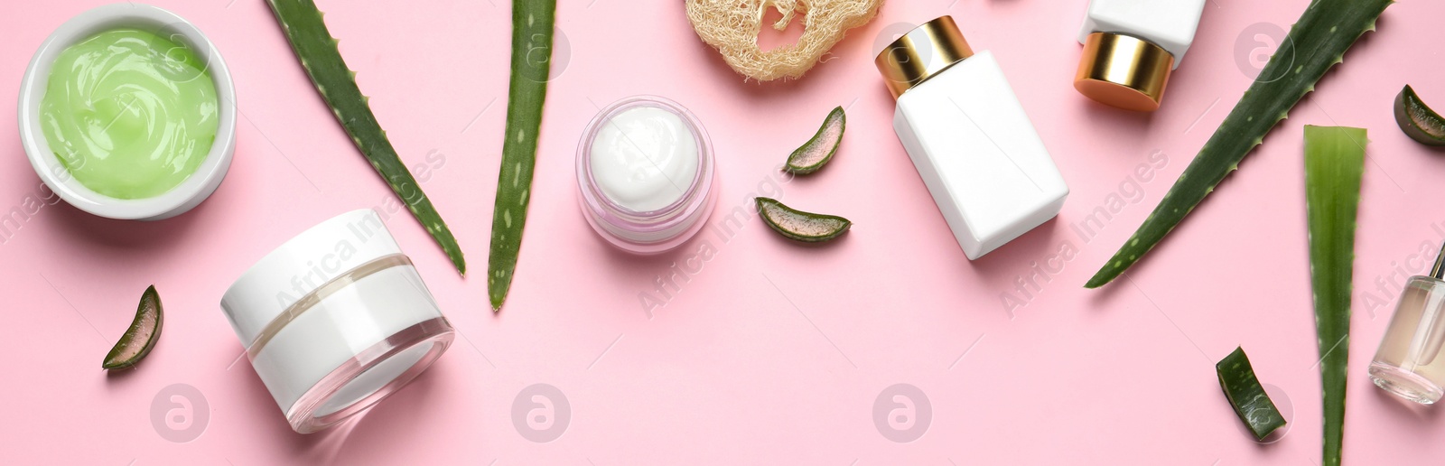 Image of Flat lay composition with spa cosmetic products on pink background. Banner design