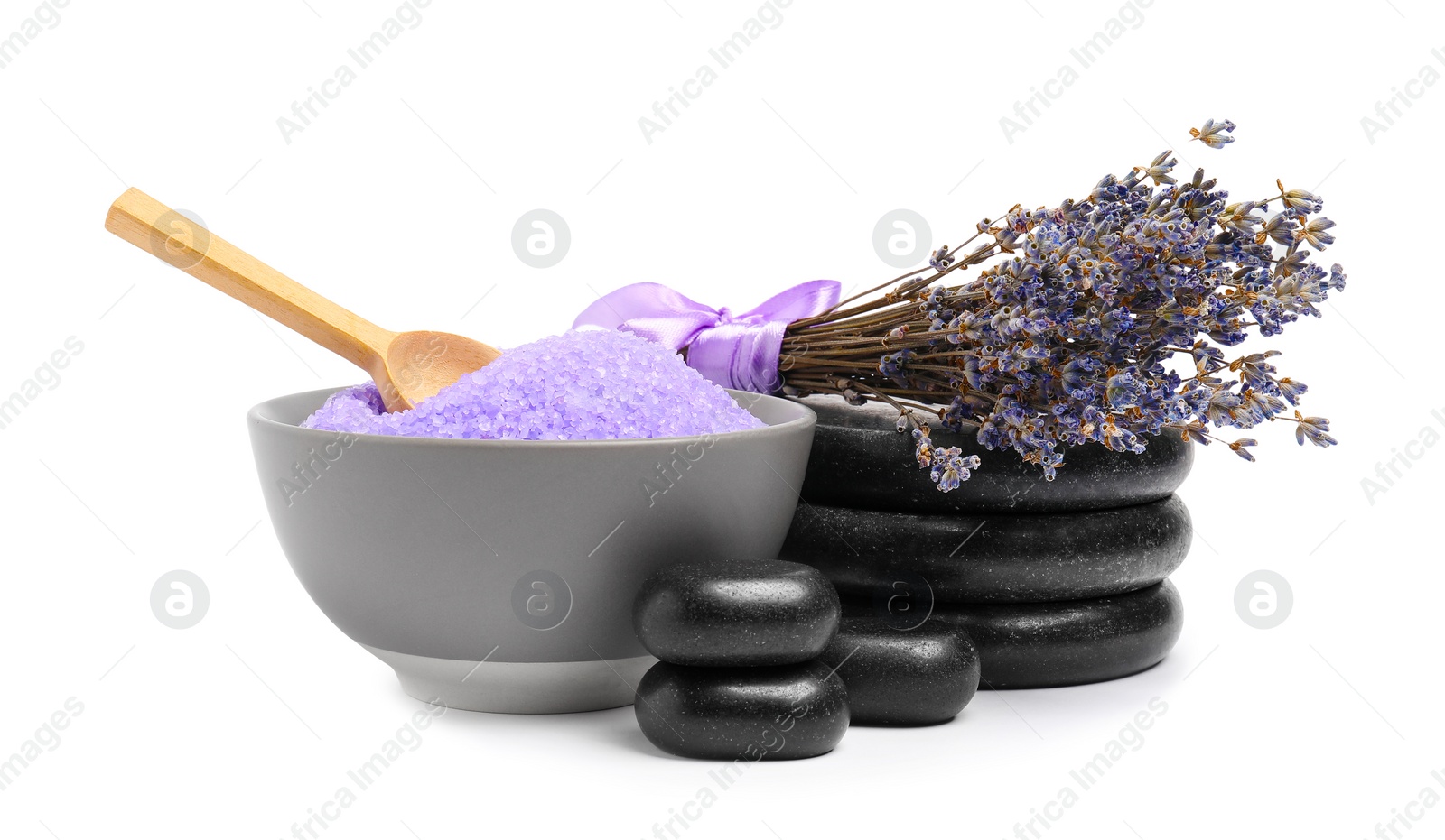 Photo of Violet sea salt in bowl, spa stones, spoon and lavender flowers isolated on white