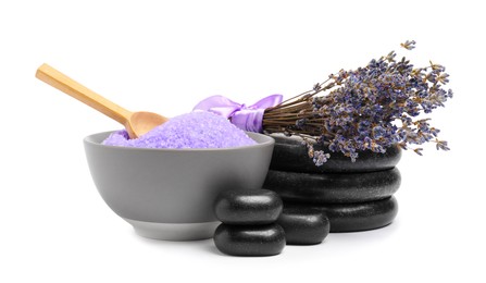 Violet sea salt in bowl, spa stones, spoon and lavender flowers isolated on white