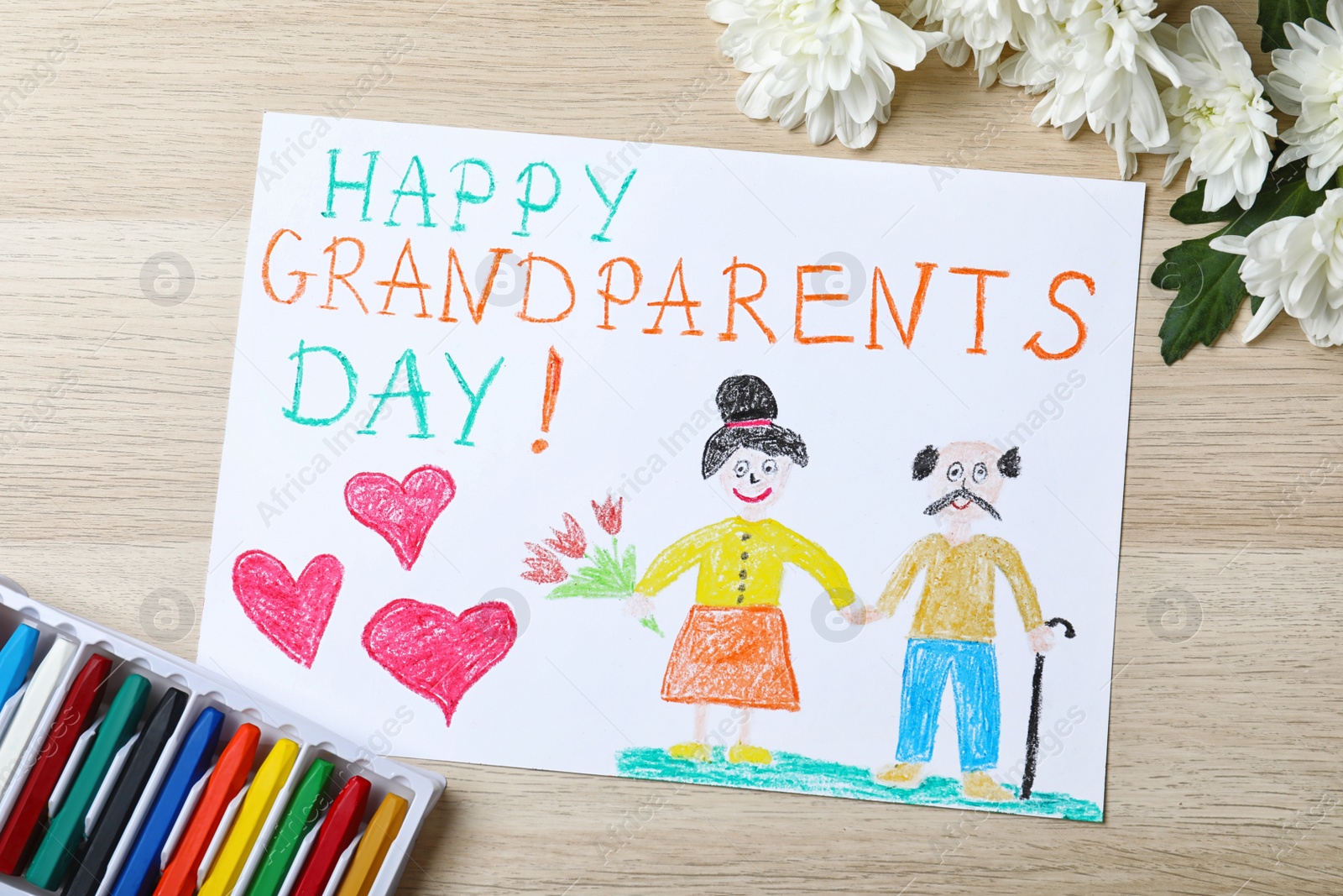 Photo of Beautiful drawing on wooden table, flat lay. Happy Grandparents Day