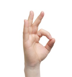 Man showing okay gesture on white background, closeup