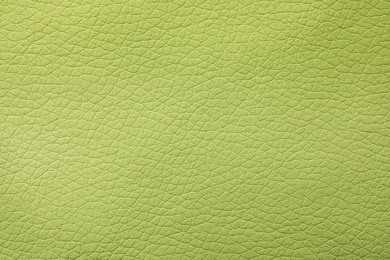 Texture of light green leather as background, closeup