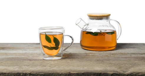 Photo of Refreshing green tea in cup and teapot on wooden table against white background