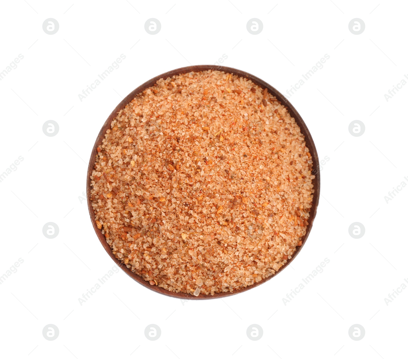 Photo of Pink salt with spices in wooden bowl isolated on white, top view