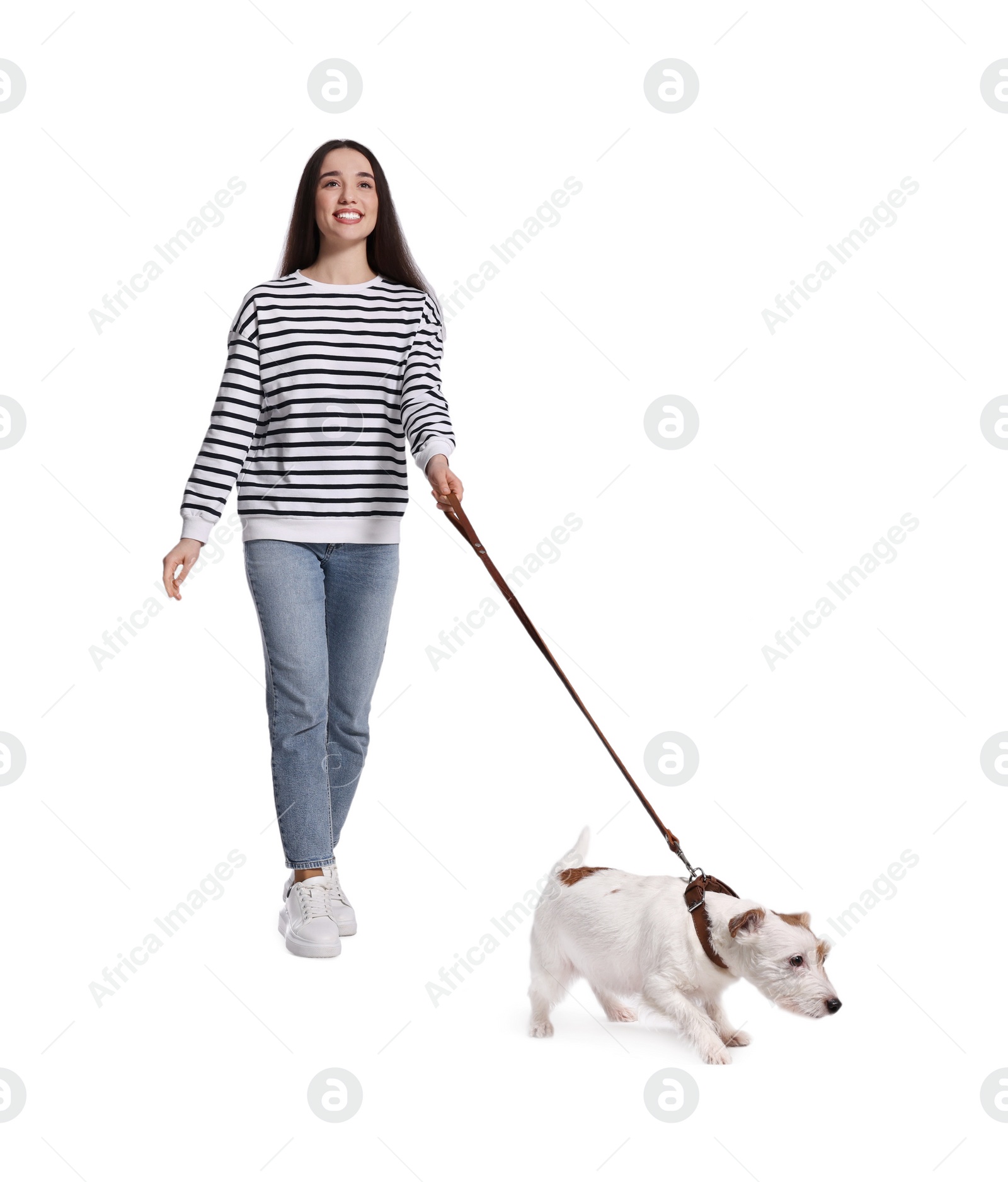 Photo of Smiling woman walking her dog on white background, low angle view