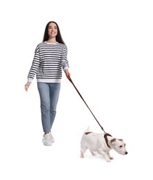 Smiling woman walking her dog on white background, low angle view