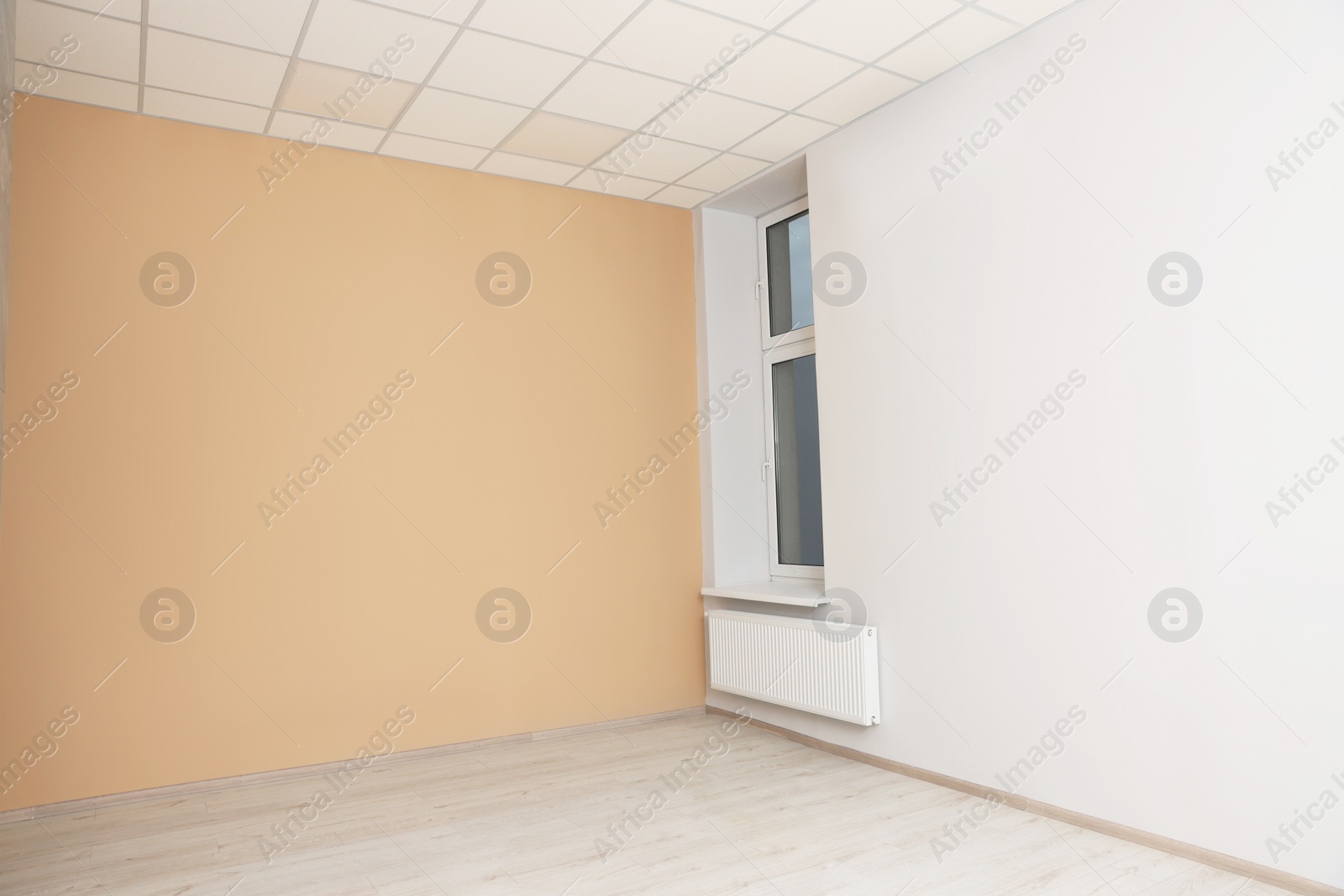 Photo of New empty office room with clean window and beige wall