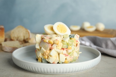 Photo of Delicious salad with crab sticks and eggs on table, closeup
